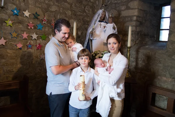 Family celebrating the baptism of their newborn baby — Stock Photo, Image