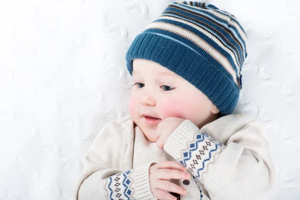 Portrait of a sweet baby in a warm knitted hat — Stock Photo, Image