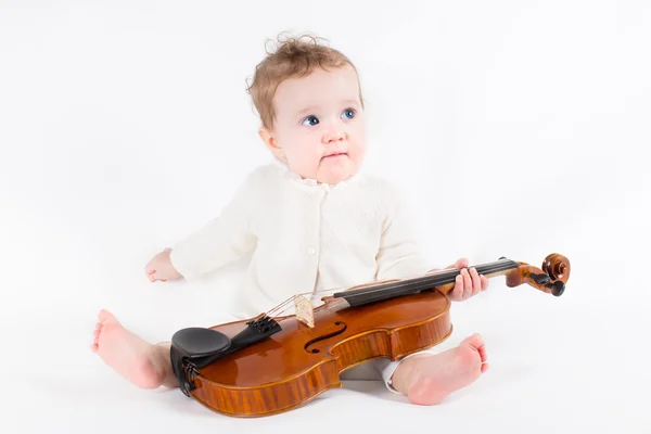 Baby girl playing with a violin — Stock Photo, Image