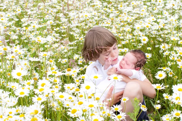 Little boy holding his baby sister — Stock Photo, Image
