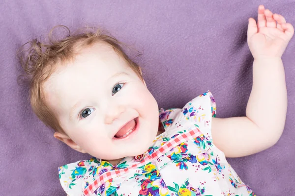 Baby girl in a colorful dress — Stock Photo, Image