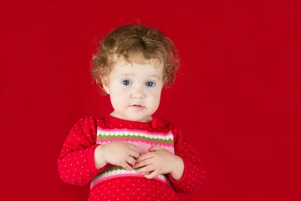 Little girl in a warm knitted sweater — Stock Photo, Image