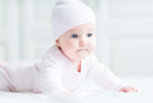Baby girl in pink knitted hat — Stock Photo, Image