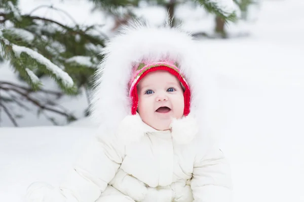 Sweet baby girl in a white jacket — Stock Photo, Image