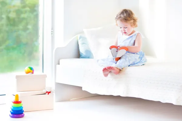 Toddler girl reading a book — Stock Photo, Image