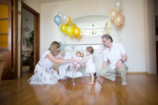 Little girl celebrating her birthday with her family — Stock Photo, Image