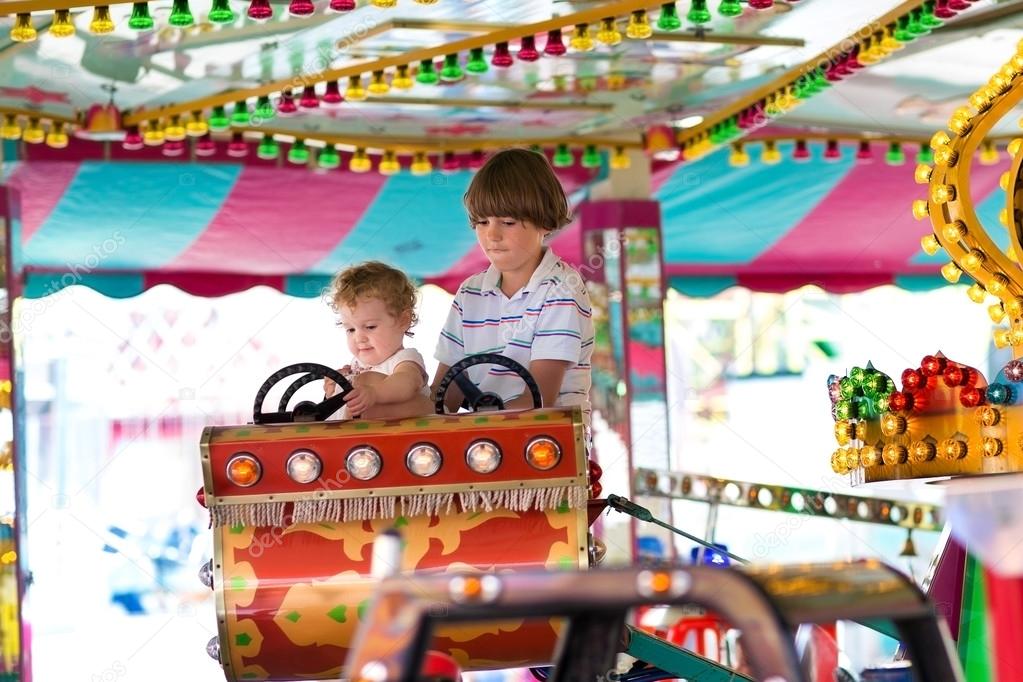 Brother and sister in an amusement park