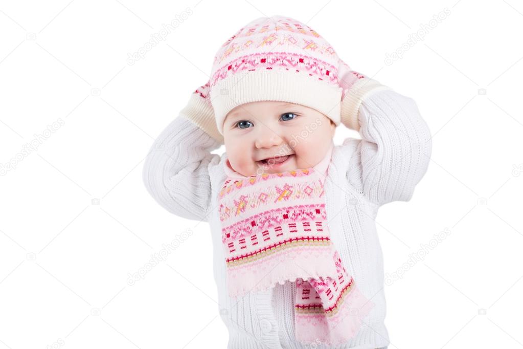Portrait of a baby girl in a knitted hat