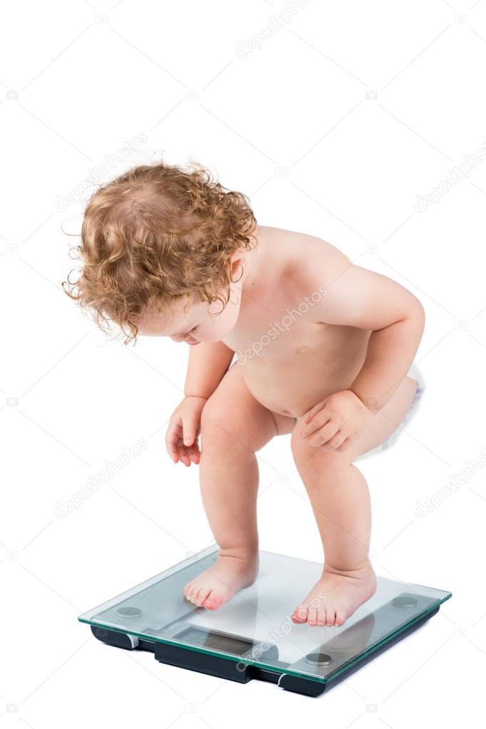 Very funny baby watching her weight Stock Photo by ©FamVeldman 43247979 Very funny baby watching her weight Stock Photo by ©FamVeldman 43247979
