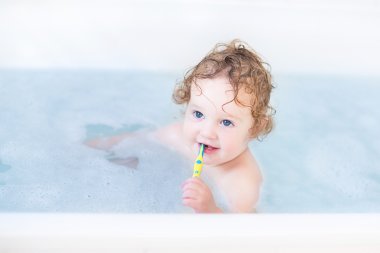 Little toddler having a bath clipart