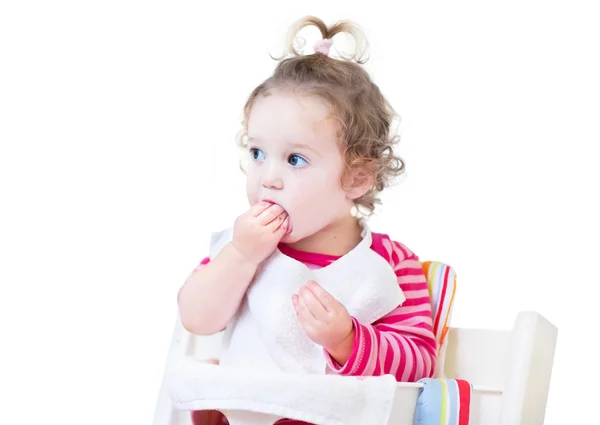 Funny baby girl eating lunch — Stock Photo, Image