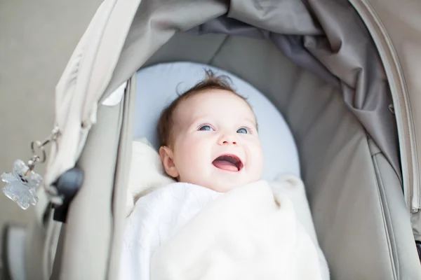 Baby sitting in a stroller — Stock Photo, Image