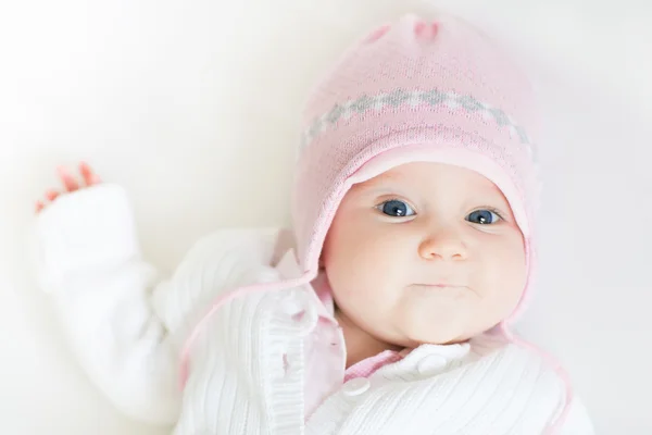 Baby girl in pink knitted hat — Stock Photo, Image