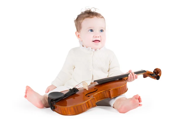 Menina bebê tocando com um grande violino — Fotografia de Stock