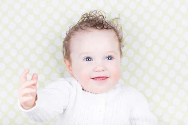 Baby in a white sweater — Stock Photo, Image