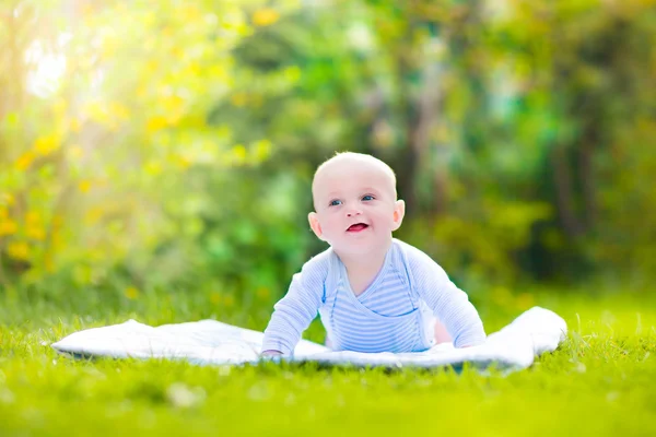 Cute laughing baby in the garden — Stock Photo, Image