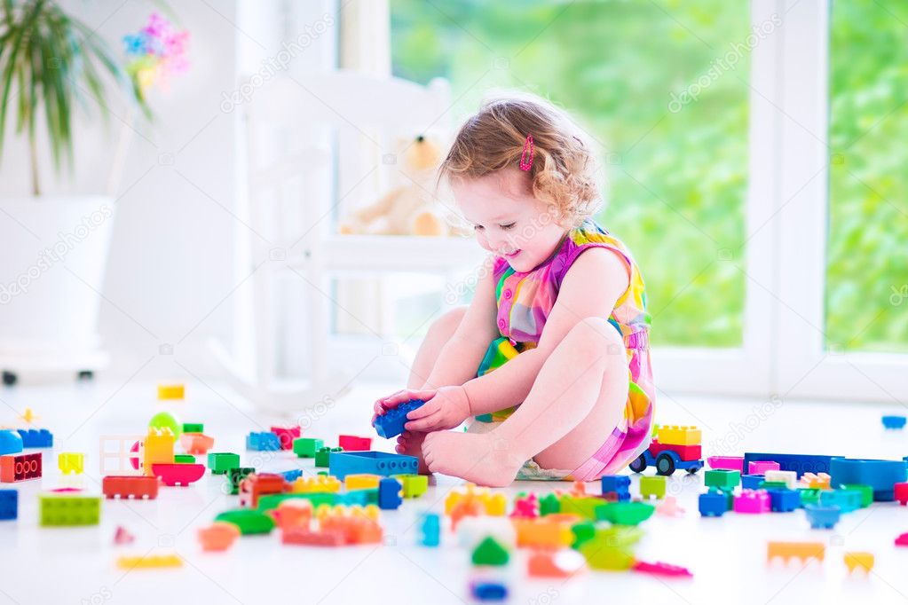 Little girl playing with blocks