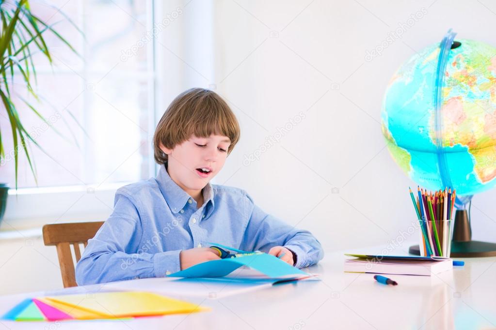 Smiling boy doing homework