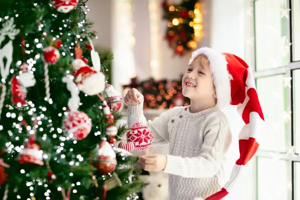 Child Decorating Christmas Tree Home Little Boy Pajamas Xmas Ornament — Stock Photo, Image