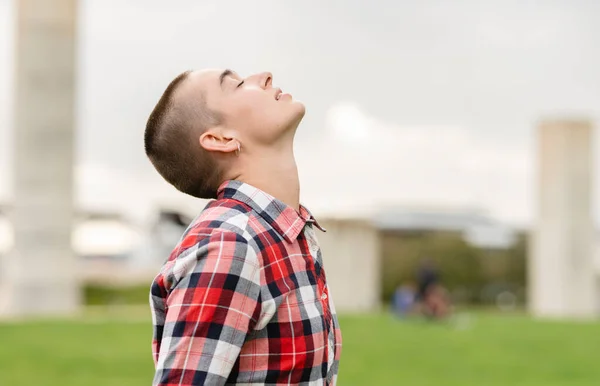 portrait of a woman with cancer oncology patient happy in nature breathes fresh air