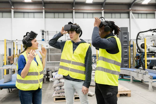 engineers use virtual reality in their robotic factory, futuristic new technology