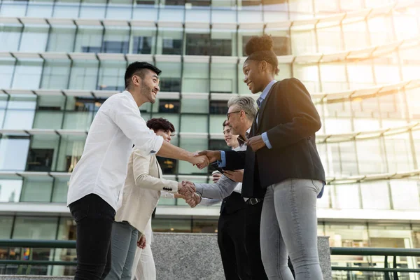 multiracial business outdoor work meeting, shake hands presentation