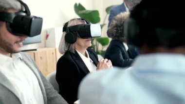 Multiracial business people using virtual reality goggles work inside metaverse. using advance technology hologram
