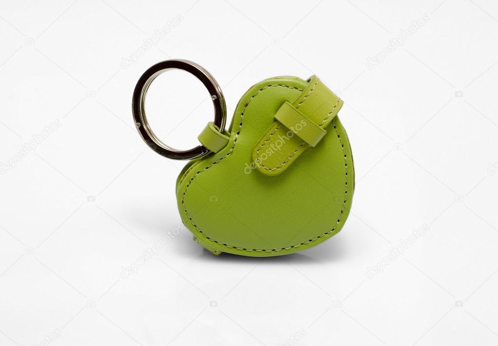 Green leather trinket isolated on white