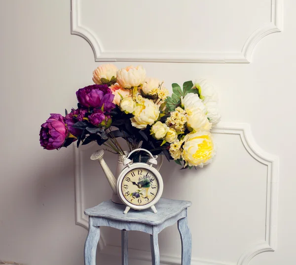 Old fashion alarm clock with peonies — Stock Photo, Image