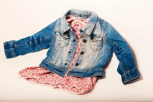 Denim jacket combined with a beautiful red dress — Stock Photo, Image