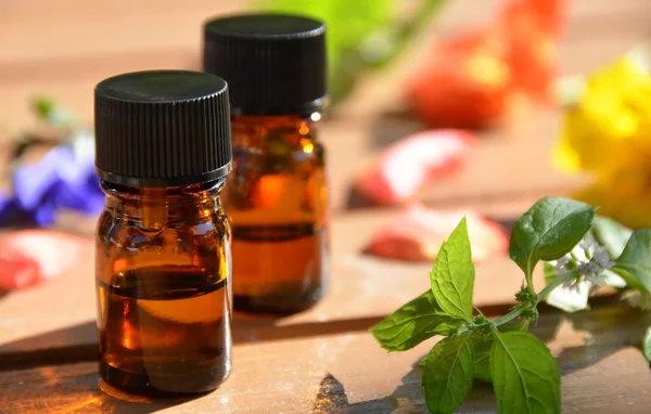 Herbal flowers and essential oils — Stock Photo, Image