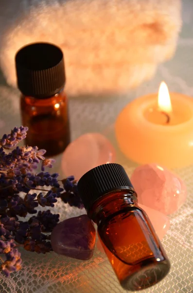 Essential oils in candle light — Stock Photo, Image