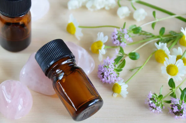 Essential oils with flowers — Stock Photo, Image