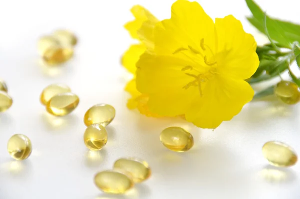 Evening primrose and supplements — Stock Photo, Image