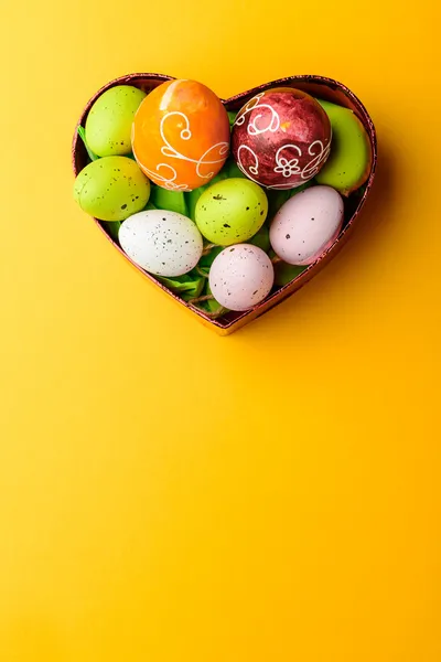 Easter Eggs on heart basket — Stock Photo, Image