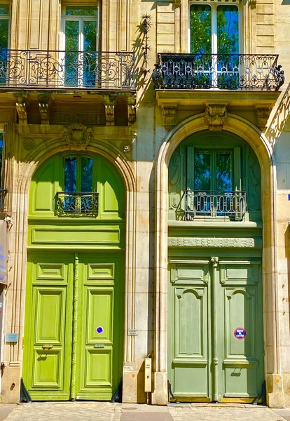 Two tall wooden doors in Paris