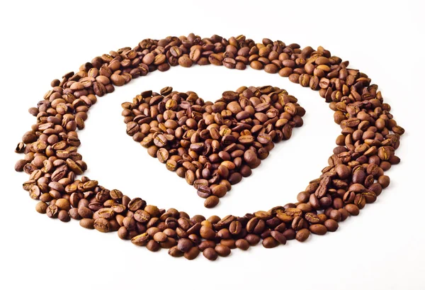 Vista 'Coração' em círculo de grãos de café — Fotografia de Stock