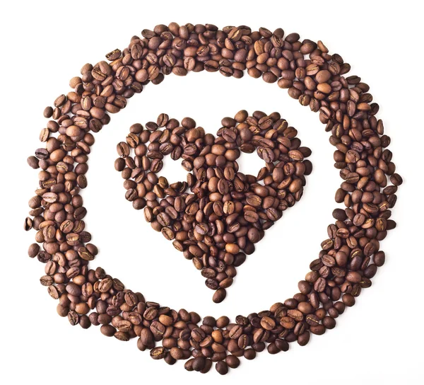 "Herz" mit Augen im Kreis aus Kaffeebohnen — Stockfoto