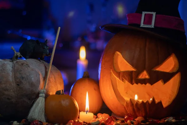 Halloween set with candy and a sculpted pumpkin head