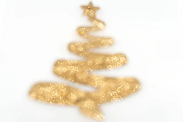 Leksak julgran av gyllene färg defocus — Stockfoto