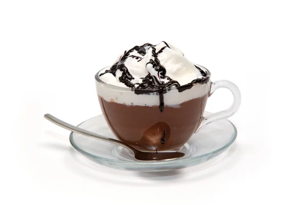 Hot chocolate with cream and syrup in glass cup — Stock Photo, Image