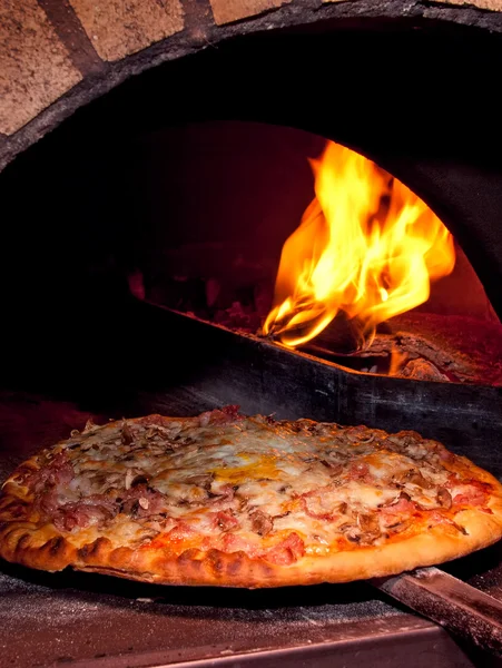 Pizza baking in the oven — Stock Photo, Image