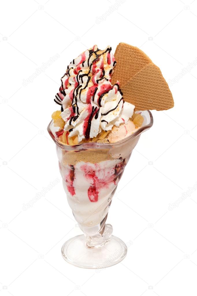 Ice cream cup with cream, topping and cookies isolated