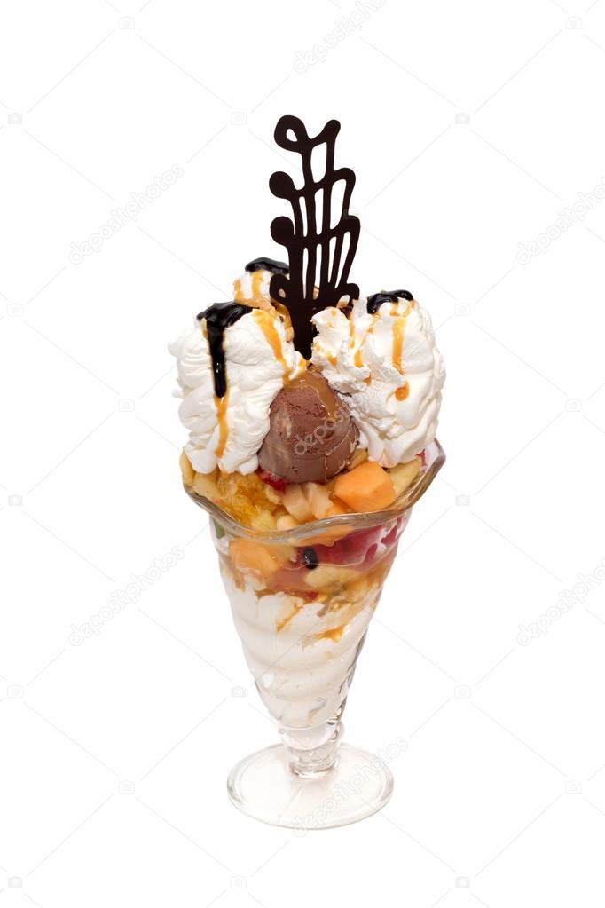 Ice cream cup with cream, topping and decoration isolated
