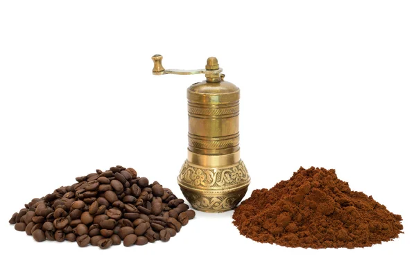 Ground coffee, coffee beans and coffee grinder between them — Stock Photo, Image