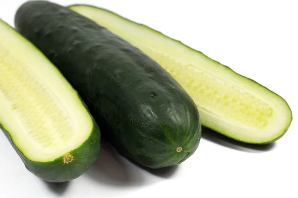 Fresh cucumber and slices isolated on white — Stock Photo, Image