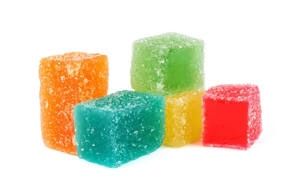 Caramelle colorate di gelatina di frutta isolate su bianco — Foto Stock