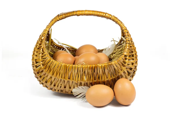 Brown Chicken Eggs and Pen in a Wicker Basket Isolated on White — Stock Photo, Image