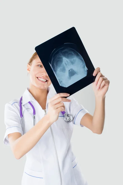 Young nurse has been studying the X-ray — Stock Photo, Image