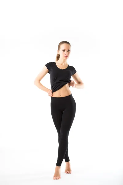 Молодая сексуальная спортсменка в черном одеянии в полный рост - изол — стоковое фото
